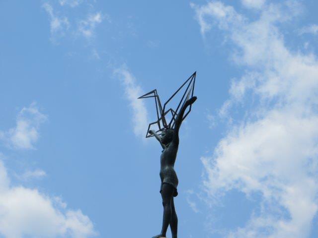 Children's peace memorial statue with paper cranes