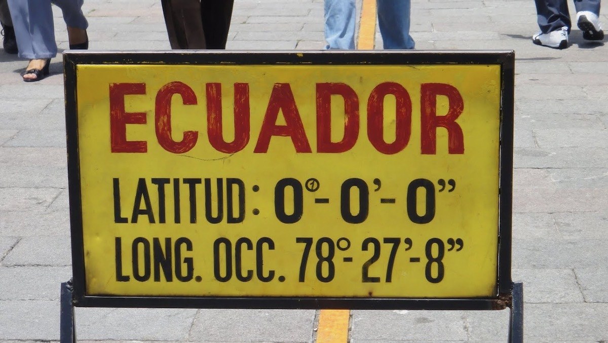 yellow sign showing 0 0 0 latitude at equator